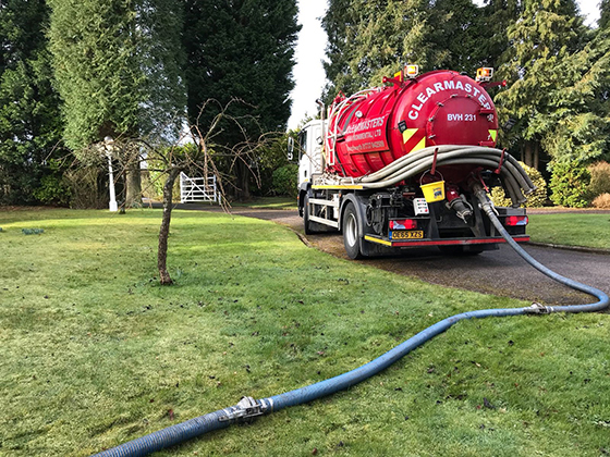 A Clearmasters tanker emptying a tank at a rural property